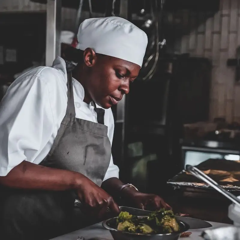 Picture of a black woman cooking food